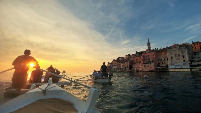 Lighted Batana boat parade and a dinner at the Spacio